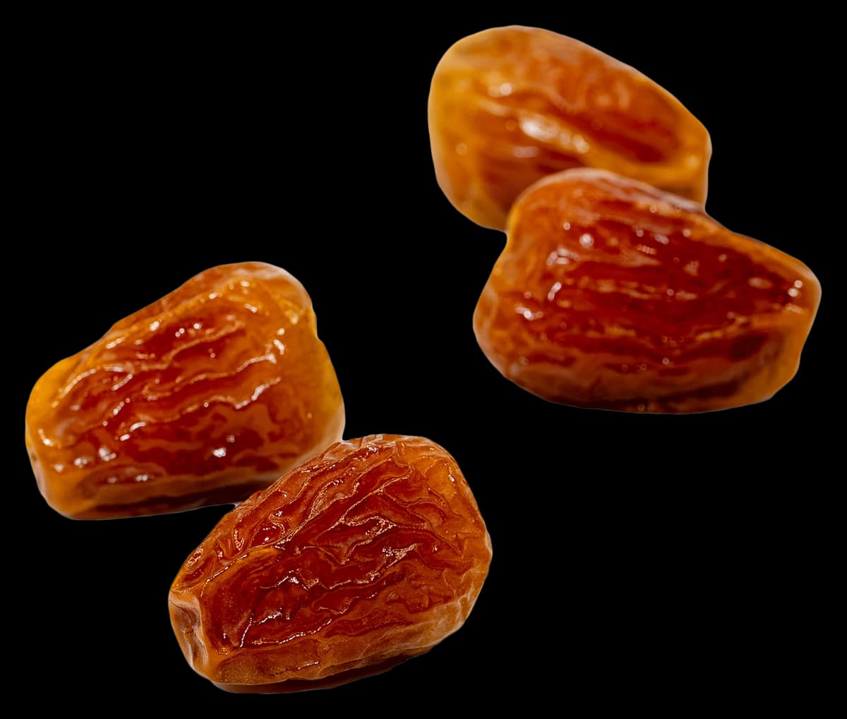 Four glossy Sukkari Galaxy dates